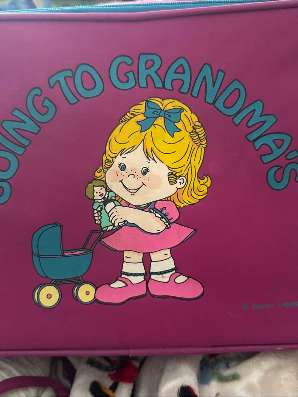 Going to Grandma's Girl with Doll with Teal Accents Carrying Suitcase